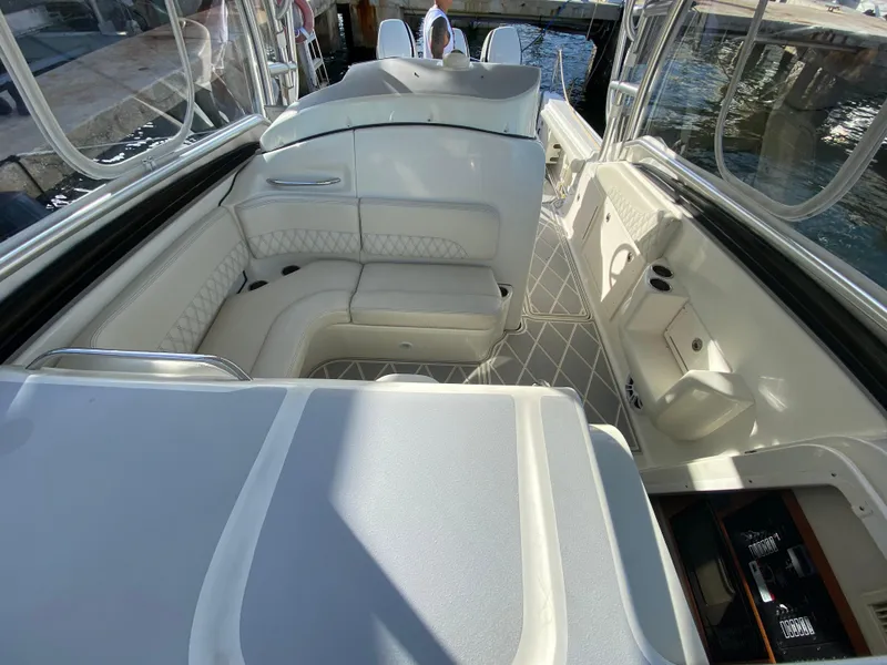 Slide: The Image of 2006 Hydra-Sports Vector 3300 VX boat interior with white seating and sleek design. - 17