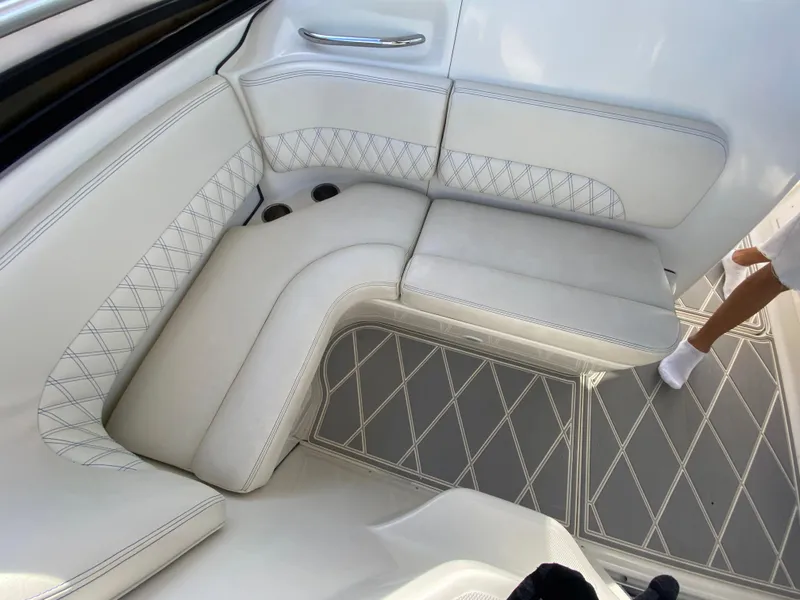 Slide: The Image of 2006 Hydra-Sports Vector 3300 VX interior with white cushioned seating and diamond-patterned flooring. - 18