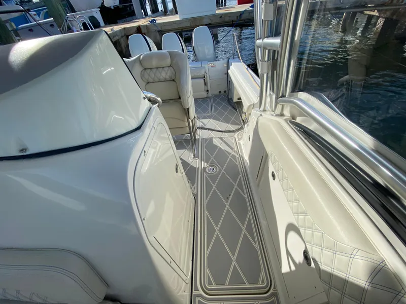 Slide: The Image of 2006 Hydra-Sports Vector 3300 VX boat interior with cushioned seating and sleek design. - 19