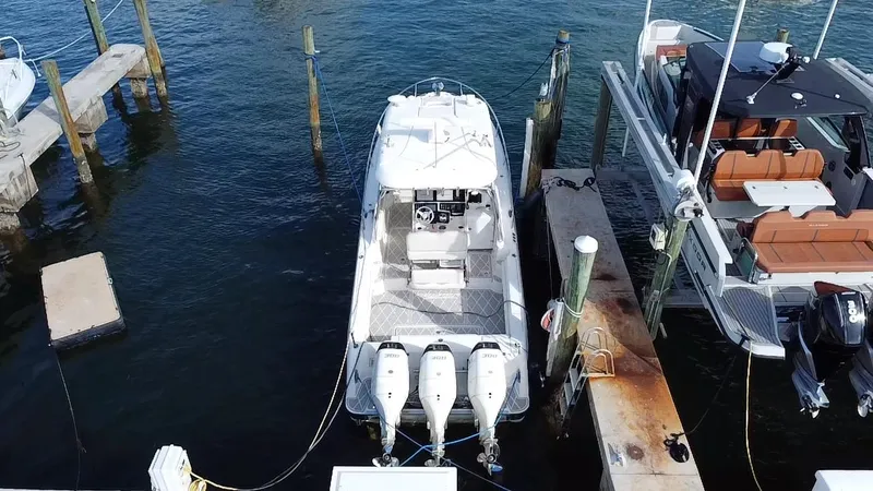 Slide: The Image of 2006 Hydra-Sports Vector 3300 VX docked with triple outboard engines, aerial view. - 27