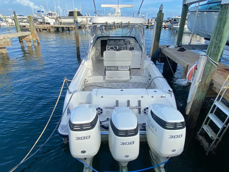 Slide: The Image of 2006 Hydra-Sports Vector 3300 VX boat docked with triple 300 horsepower engines. - 29