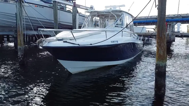 Slide: The Image of 2006 Hydra-Sports Vector 3300 VX boat docked at marina. - 3