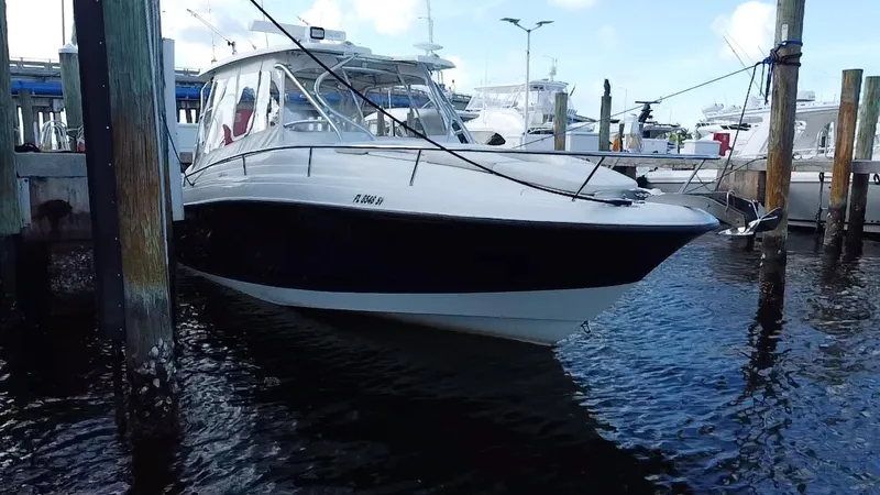 Slide: The Image of 2006 Hydra-Sports Vector 3300 VX boat docked at marina, side view. - 5