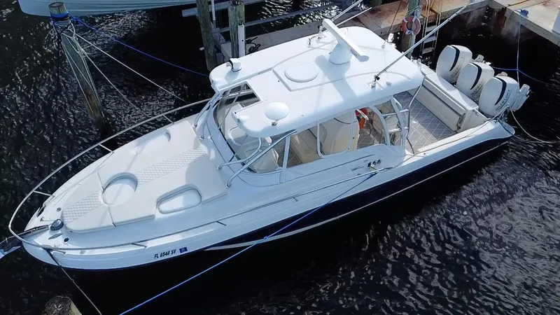 Slide: The Image of 2006 Hydra-Sports Vector 3300 VX boat docked, aerial view, white and sleek design. - 6