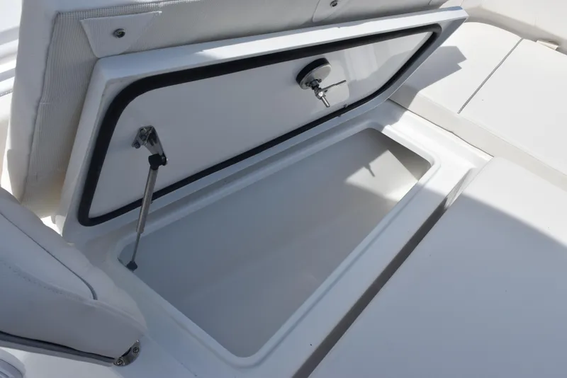 Slide: The Image of Open storage compartment on 2026 Sea Hunt Gamefish 27 Forward Seating boat. - 17