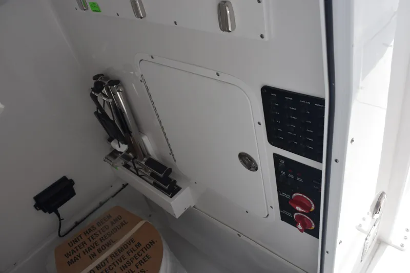 Slide: The Image of Interior view of 2026 Sea Hunt Gamefish 27 Forward Seating boat controls and storage. - 19