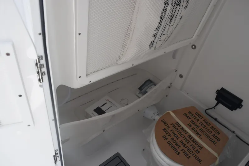 Slide: The Image of Interior of 2026 Sea Hunt Gamefish 27, featuring storage and marine toilet. - 20