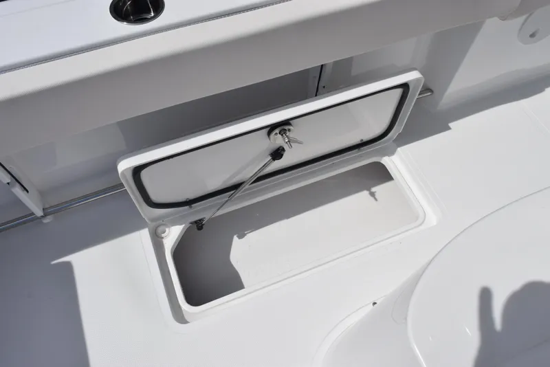 Slide: The Image of Open storage compartment on 2026 Sea Hunt Gamefish 27 Forward Seating boat. - 22