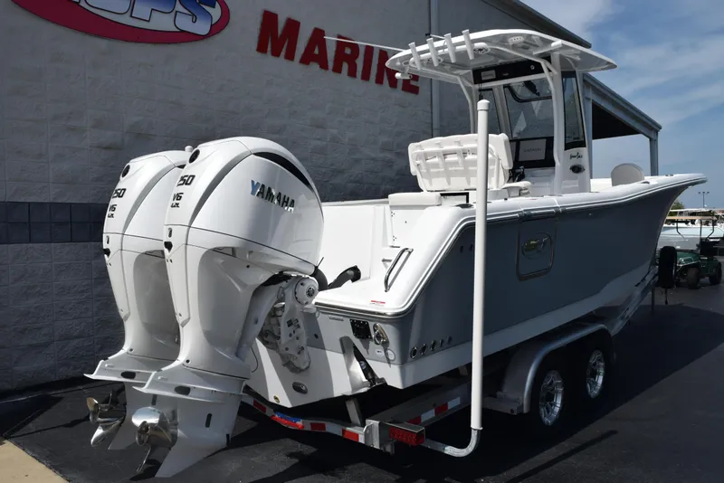 Slide: The Image of 2026 Sea Hunt Gamefish 27 boat with twin Yamaha 150 engines on a trailer. - 4