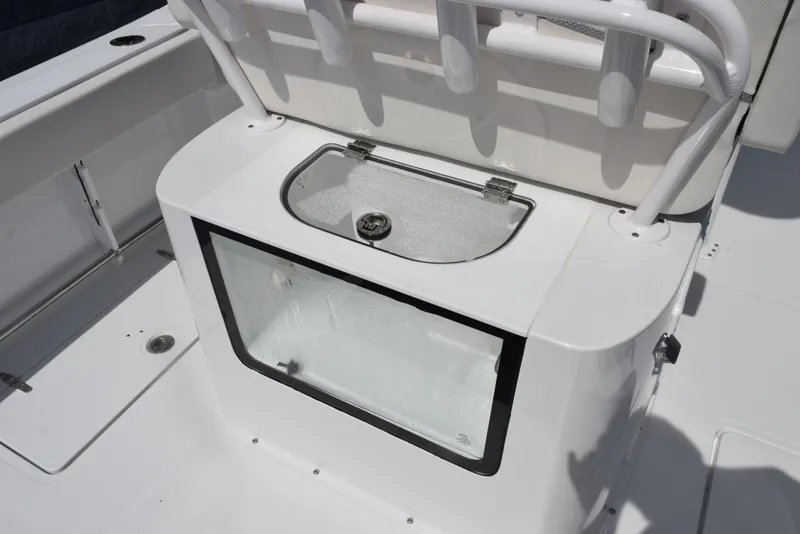 Slide: The Image of Livewell on 2026 Sea Hunt Gamefish 27 Forward Seating boat, featuring rod holders and seating. - 9