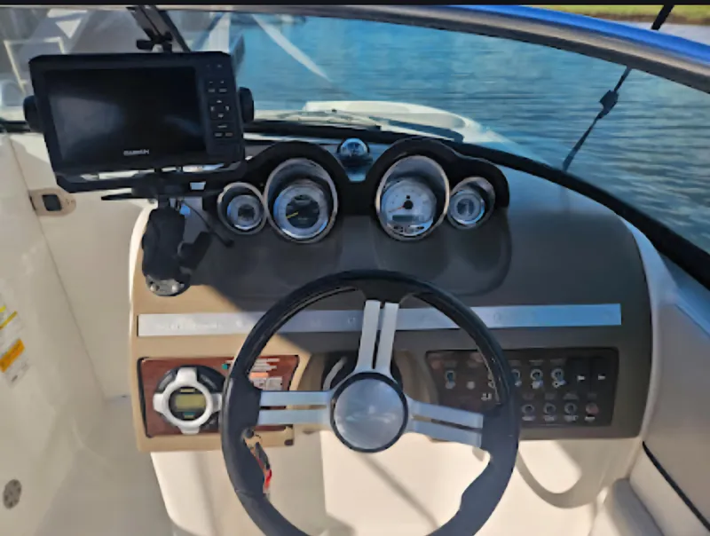Slide: The Image of Steering console of 2013 Sea Ray 260 Sundeck with gauges and navigation system. - 13