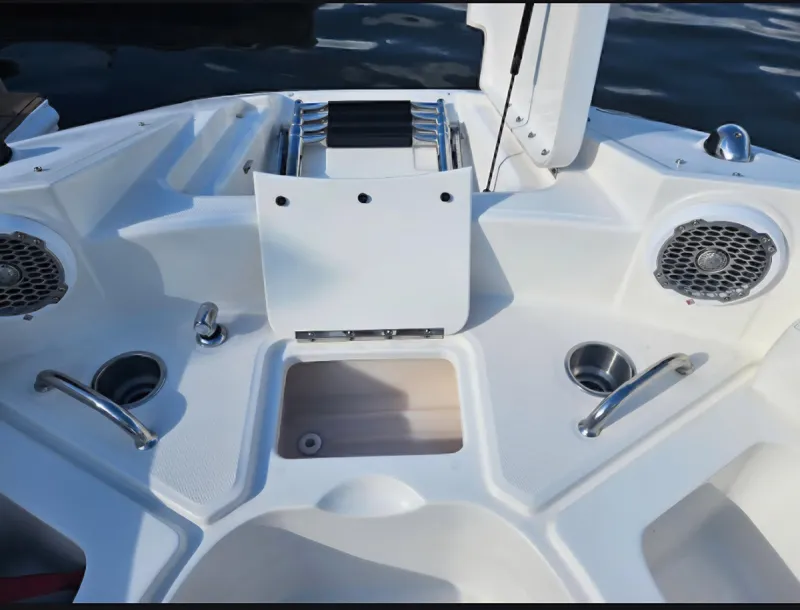 Slide: The Image of 2013 Sea Ray 260 Sundeck boat interior with speakers and cup holders. - 3