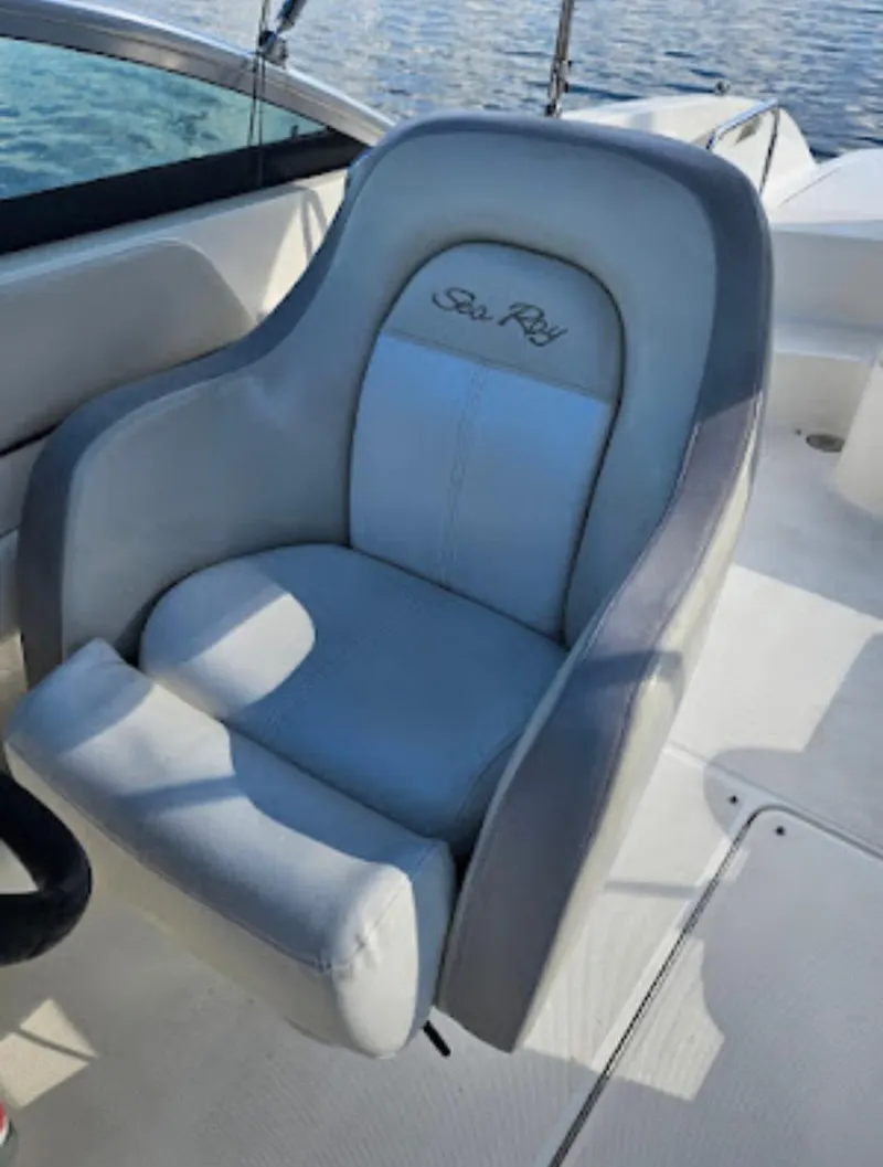 Slide: The Image of 2013 Sea Ray 260 Sundeck boat seat with embroidered logo, on a sunny day. - 4