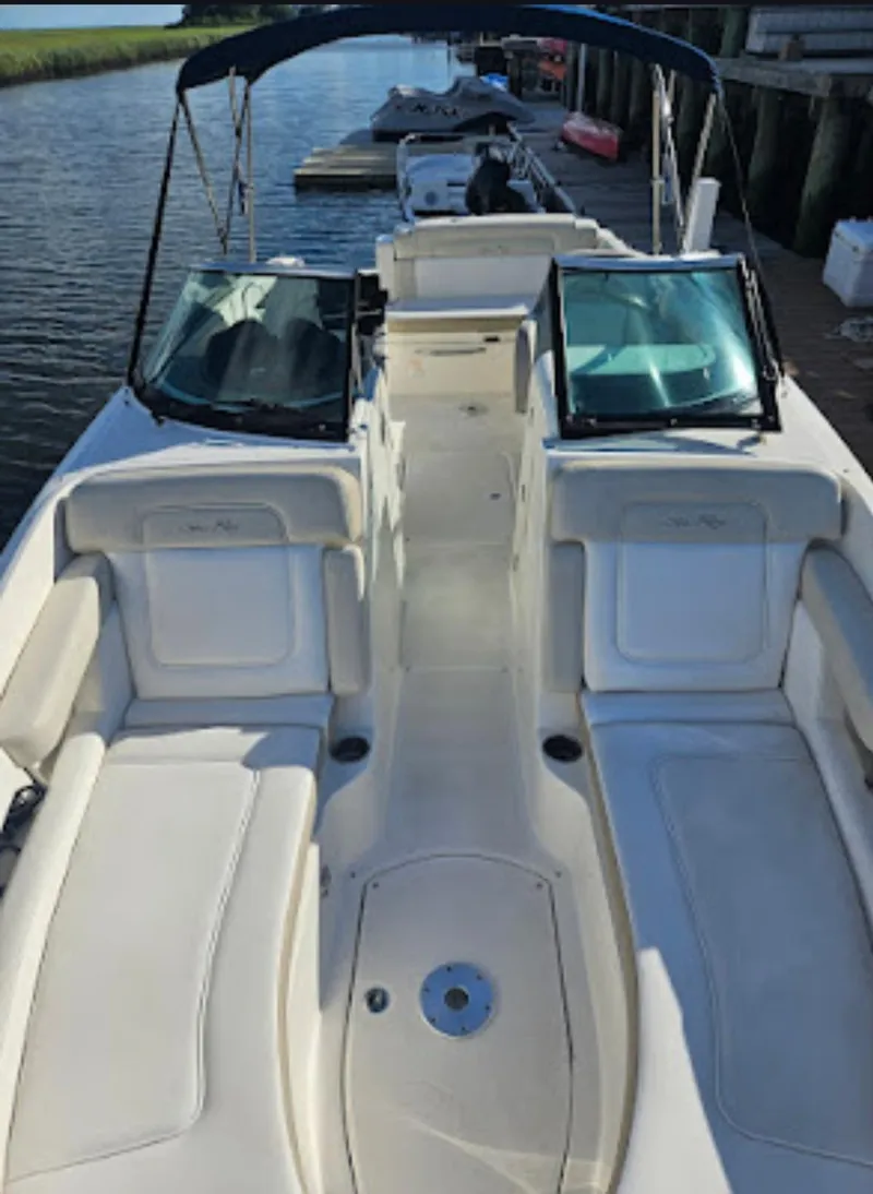 Slide: The Image of 2013 Sea Ray 260 Sundeck boat with spacious seating and open deck design. - 8