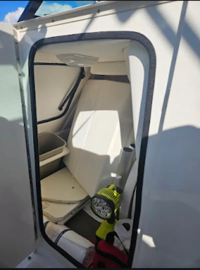 Slide: The Image of Interior view of 2013 Sea Ray 260 Sundeck boat cabin with storage and equipment. - 9