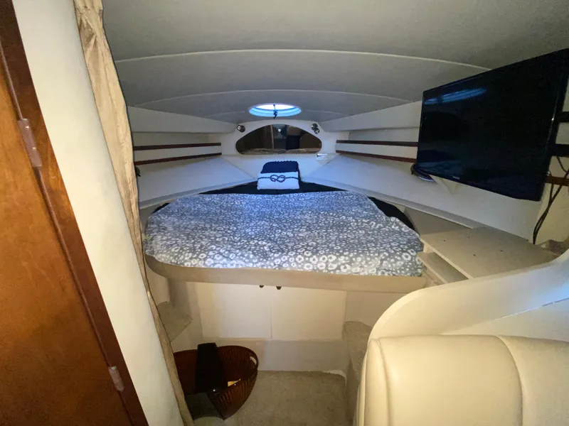 Slide: The Image of Interior cabin of 2002 Cruisers Yachts 3372 Express with bed and TV. - 18