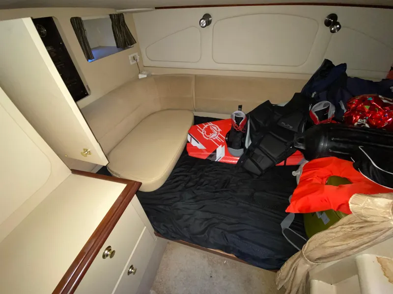 Slide: The Image of Interior of 2002 Cruisers Yachts 3372 Express with seating and boating gear. - 21