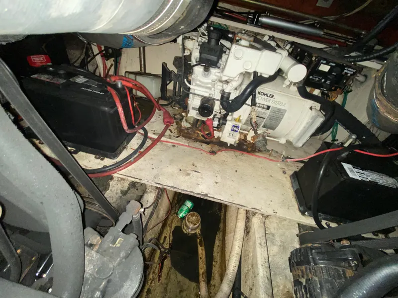Slide: The Image of Engine compartment of 2002 Cruisers Yachts 3372 Express with Kohler power system and batteries. - 27
