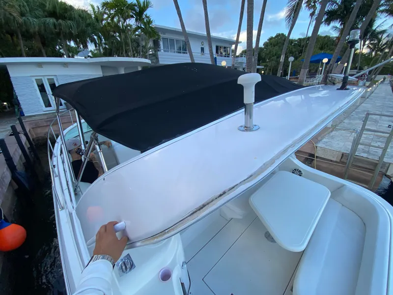 Slide: The Image of 2002 Cruisers Yachts 3372 Express docked, featuring a sleek design and spacious deck area. - 28