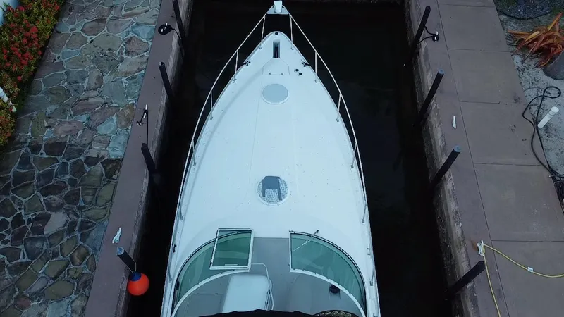 Slide: The Image of Top view of a 2002 Cruisers Yachts 3372 Express docked in a narrow slip. - 9
