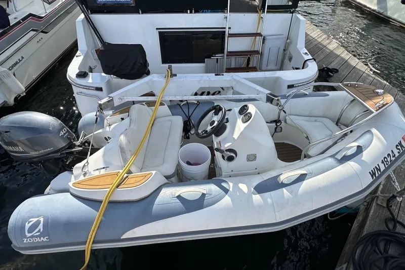 Slide: The Image of Inflatable boat docked beside a 1993 Ocean Alexander 460 yacht. - 15