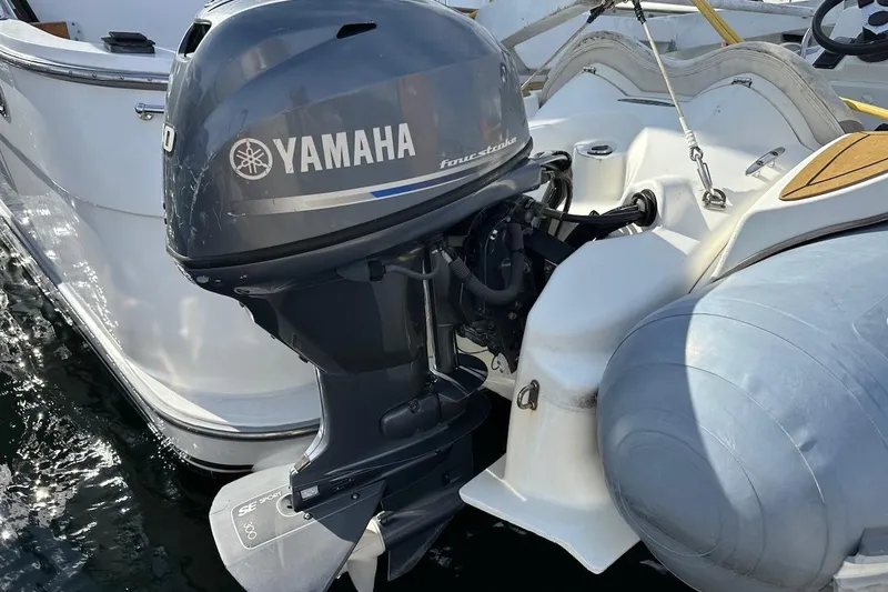 Slide: The Image of Yamaha outboard motor on Ocean Alexander 460, 1993 model, docked at marina. - 16