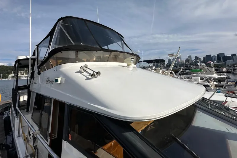 Slide: The Image of 1993 Ocean Alexander 460 yacht docked with city skyline in background. - 31