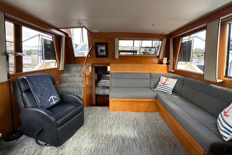 Slide: The Image of Luxurious 1993 Ocean Alexander 460 yacht interior with cozy seating and nautical decor. - 32