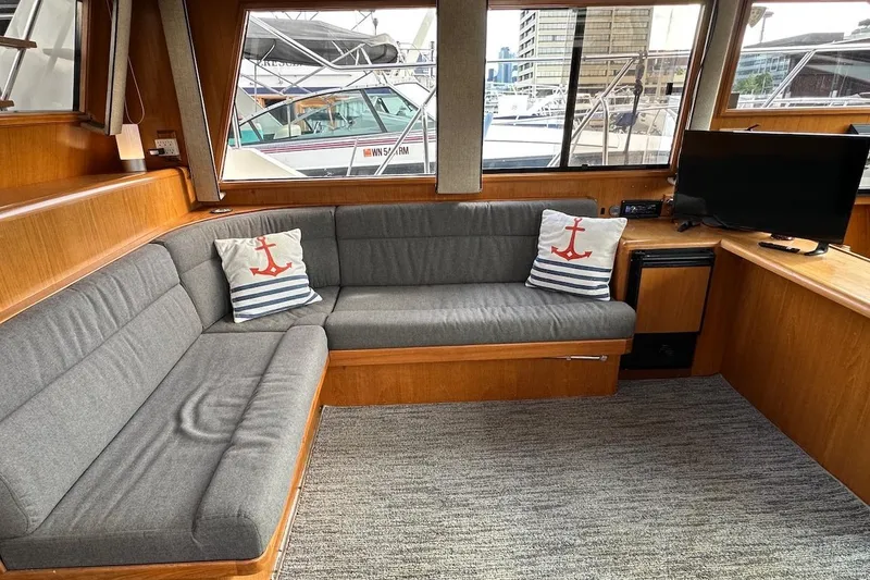 Slide: The Image of Interior of 1993 Ocean Alexander 460 yacht with gray seating and nautical decor. - 34
