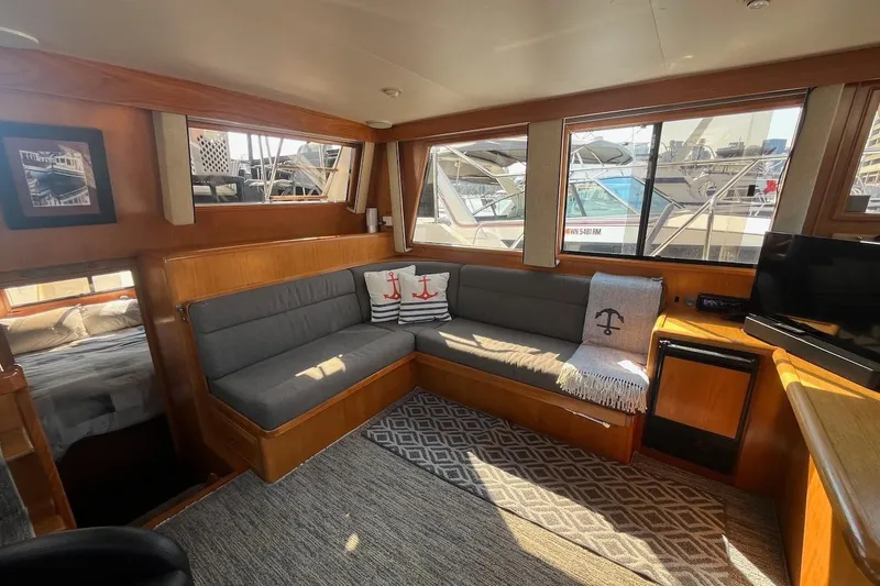 Slide: The Image of Luxurious interior of 1993 Ocean Alexander 460 yacht with cozy seating and elegant decor. - 35