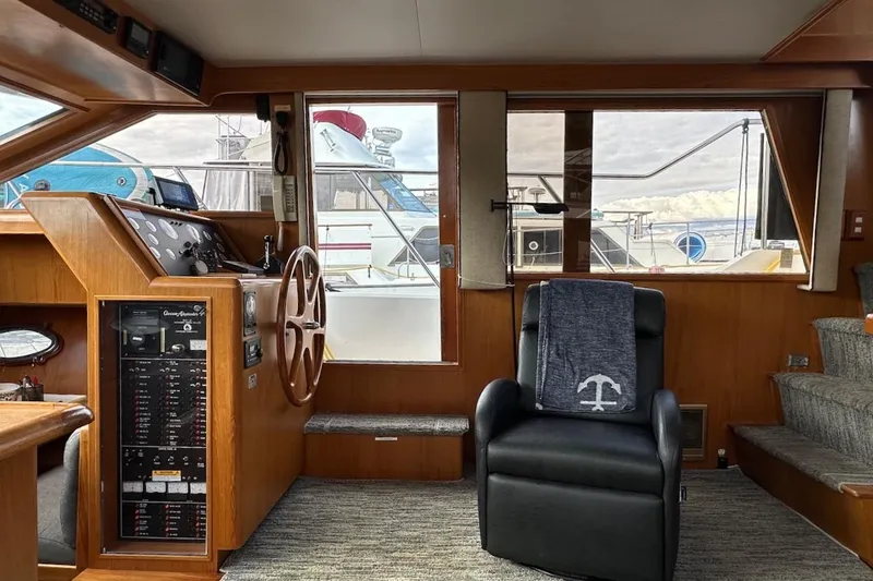 Slide: The Image of Interior of 1993 Ocean Alexander 460 yacht with helm, steering wheel, and comfortable seating. - 37