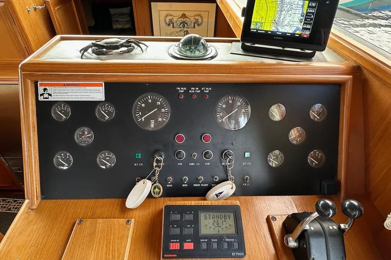 Slide: The Image of Control panel of a 1993 Ocean Alexander 460 yacht with navigation instruments and gauges. - 40