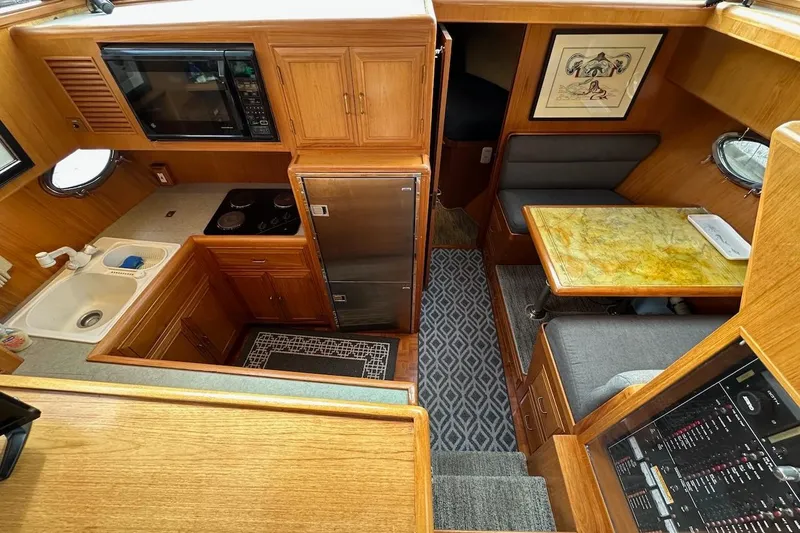 Slide: The Image of Interior of 1993 Ocean Alexander 460 yacht with kitchen and dining area. - 42