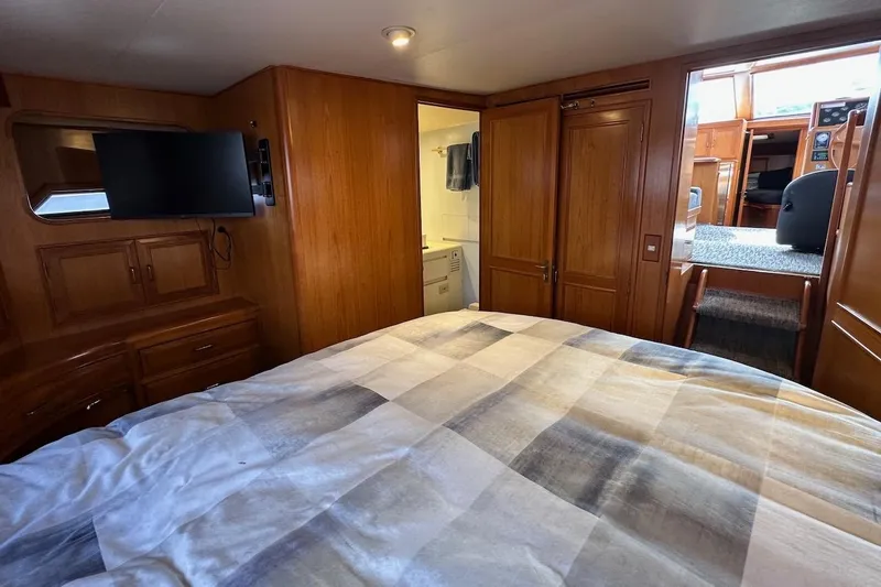 Slide: The Image of Luxurious 1993 Ocean Alexander 460 yacht interior with cozy bedroom and modern amenities. - 55