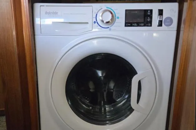 Slide: The Image of Washing machine installed in a 1993 Ocean Alexander 460 yacht interior. - 57