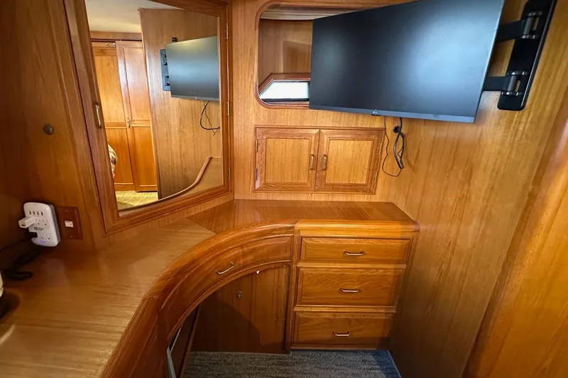Slide: The Image of Interior of 1993 Ocean Alexander 460 yacht with wooden cabinetry and mounted TV. - 58