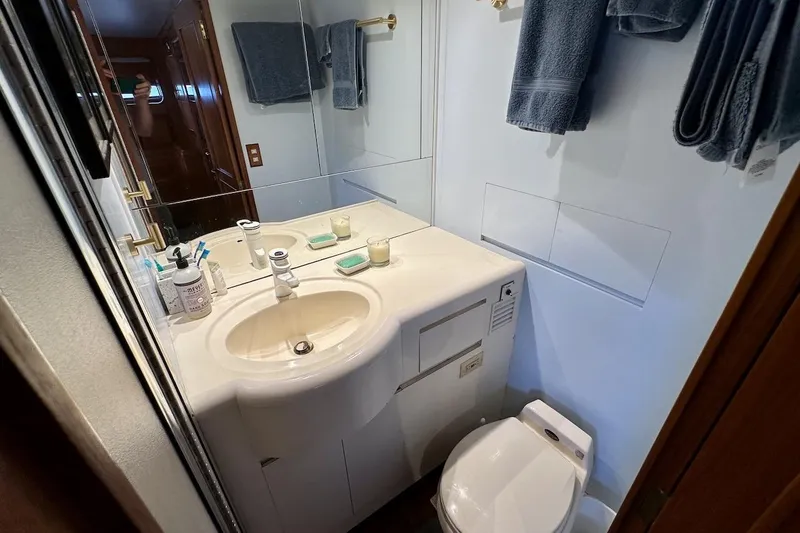 Slide: The Image of Bathroom interior of 1993 Ocean Alexander 460 yacht with sink, mirror, and towels. - 59