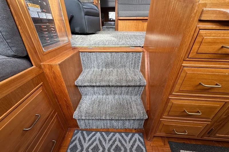 Slide: The Image of Interior of 1993 Ocean Alexander 460 yacht with carpeted stairs and wooden cabinetry. - 60