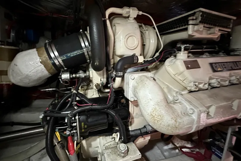 Slide: The Image of Engine room of 1993 Ocean Alexander 460 yacht, featuring a Caterpillar engine. - 67