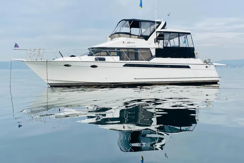 Slide: The Image of Ocean Alexander 460 yacht from 1993 on calm water, reflecting beautifully. - 69