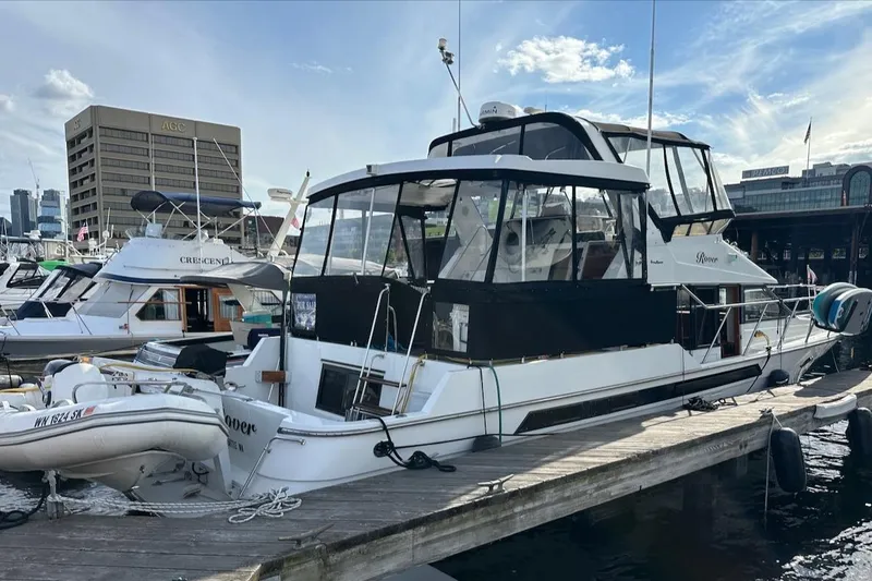 Slide: The Image of 1993 Ocean Alexander 460 yacht docked at marina under a partly cloudy sky. - 9