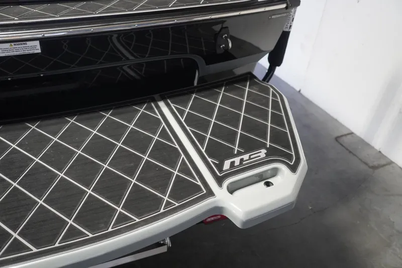 Slide: The Image of 2024 MB B52 23 Classic boat platform with diamond-patterned design. - 11