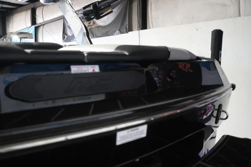 Slide: The Image of 2024 MB B52 23 Classic boat rear view in a garage setting. - 12