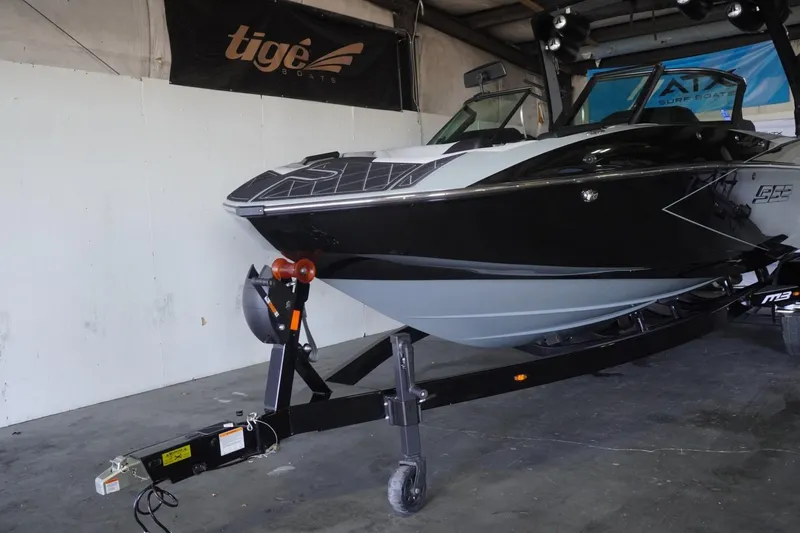 Slide: The Image of 2024 MB B52 23 Classic boat on trailer in indoor showroom. - 2