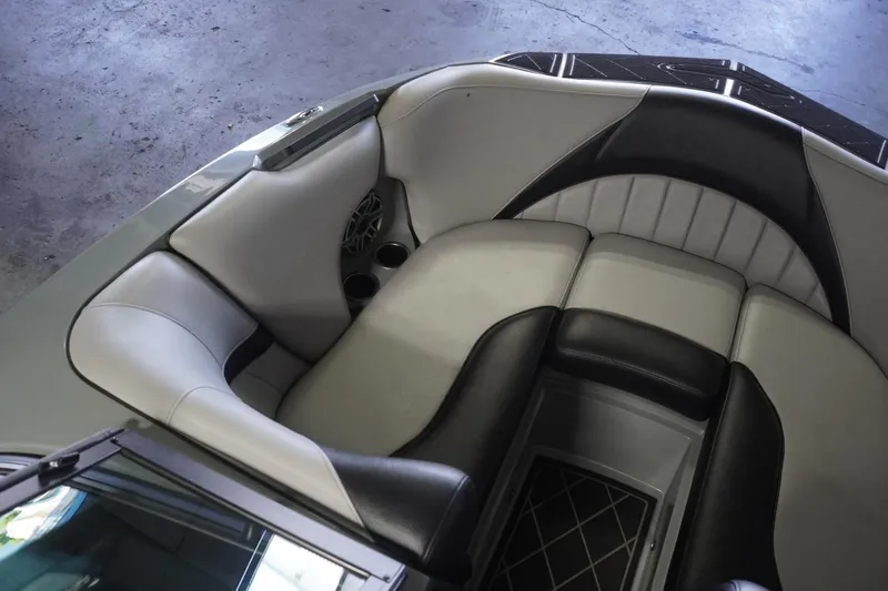 Slide: The Image of 2024 MB B52 23 Classic boat interior with sleek black and gray seating. - 24