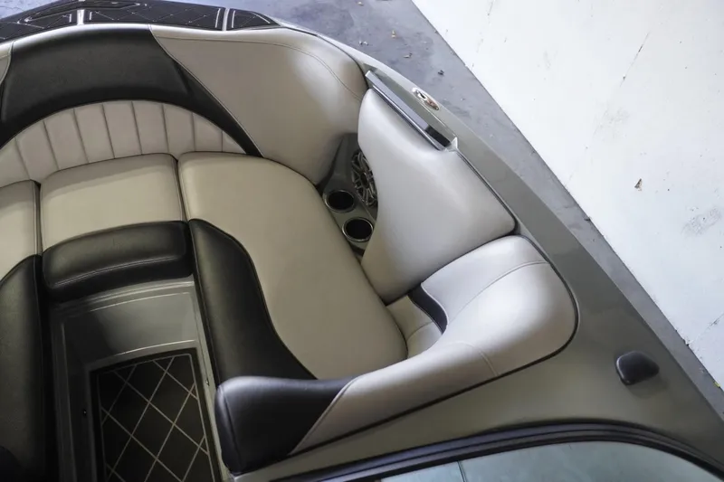 Slide: The Image of 2024 MB B52 23 Classic boat interior with sleek, modern seating and cup holders. - 25