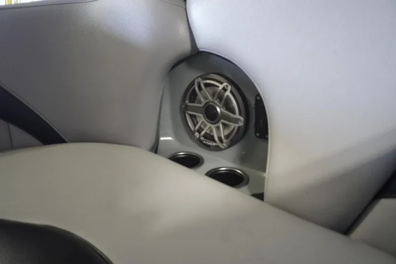 Slide: The Image of Interior of 2024 MB B52 23 Classic featuring speaker and cup holders. - 26