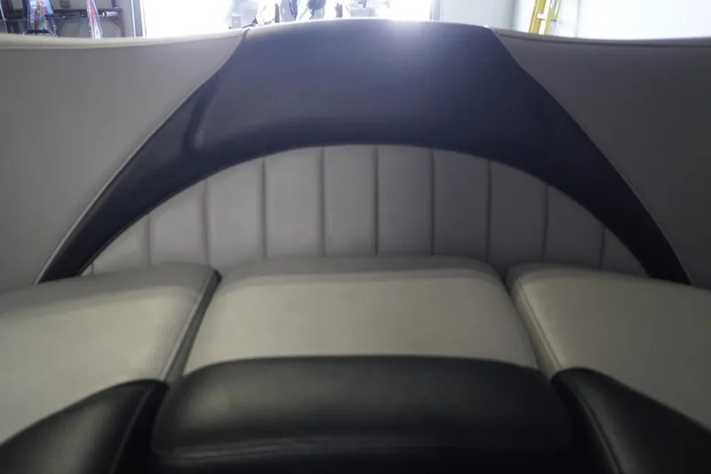 Slide: The Image of 2024 MB B52 23 Classic boat interior with sleek black and gray seating. - 27