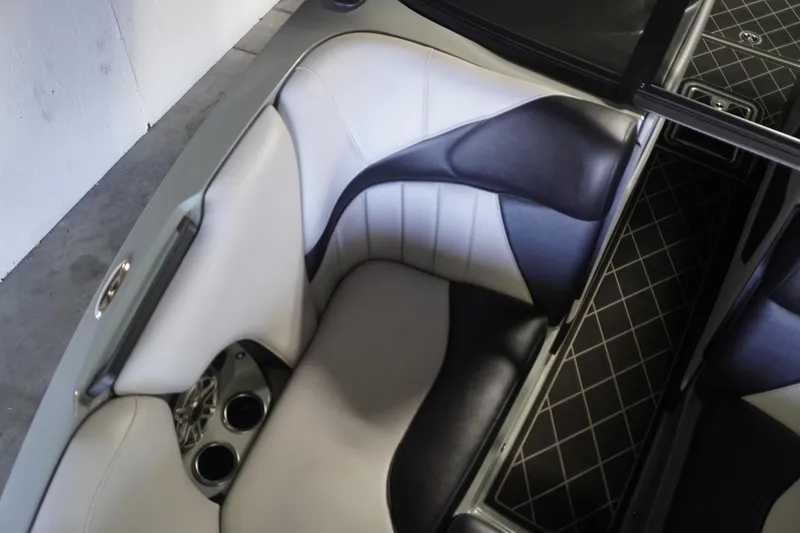 Slide: The Image of 2024 MB B52 23 Classic boat interior with stylish seating and cup holders. - 31