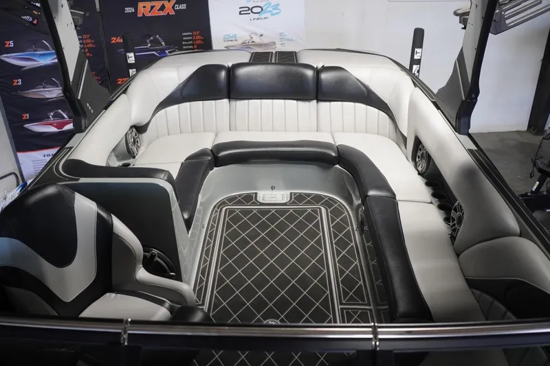 Slide: The Image of 2024 MB B52 23 Classic boat interior with black and white seating and modern design. - 33